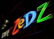 zedz cafe neon sign. red yellow blue green