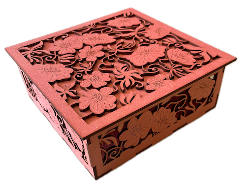 Floral Petal Power Treasure Trove Laser Cutting Project - This intricately designed wooden box is a stunning piece of laser-cut craftsmanship. The floral motifs on the lid and the sides are delicately carved, giving it an elegant, lacy appearance. It’s perfect for storing keepsakes, jewellery, or tiny treasures, making it an ideal gift for special occasions.