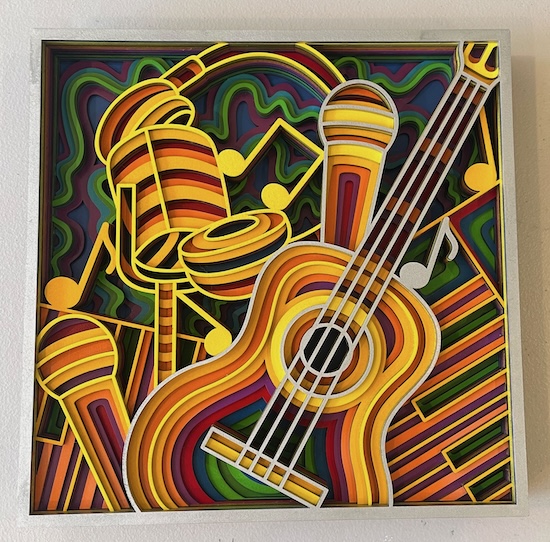 Musical Mosaic Symphony Laser Cutting Project - This vibrant laser-cut artwork features a bold and colourful guitar surrounded by microphones and soundwaves in a psychedelic-inspired design. The multi-layered composition, filled with rich orange, yellow, green, and red hues, creates a sense of dynamic movement. This piece captures the energy of live performances and musical expression, perfect for music lovers. It’s an eye-catching decorative piece, ideal for a creative studio, music room, or modern living space.