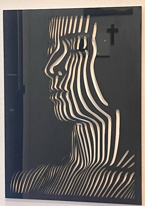 Head in Harmony Laser Cutting Project - This laser-cut artwork showcases the layered silhouette of a woman’s head, captured with flowing, abstract contours. Each line emphasizes the graceful structure of her profile, creating a mesmerizing interplay of light and shadow. Crafted with precision, this design is a perfect project for anyone looking to explore artistic laser cutting.