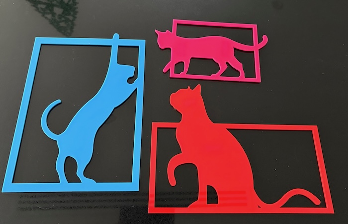 Frame the Fur-tastic Cats Laser Cutting Project - Add a touch of feline flair to your home with these colorful laser-cut cat silhouettes! Featuring three unique designs—a sitting cat, a walking cat, and a playful cat stretching—each silhouette is framed for a modern and sleek look. This project is easy to make and perfect for cat lovers. Download the design files, follow the instructions, and create these vibrant pieces for yourself or as gifts. Ideal for wall art or fun décor projects!