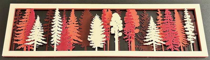 The Enchanted Forest Wall Art Laser Cutting Project - Transform any space with this beautifully layered laser-cut forest scene! This intricate design features multiple layers of trees in various shades, creating a stunning depth effect. This project comes with tips and images, perfect for home décor, gifts, or seasonal decorations.  You can bring this scenic beauty to life in your workshop. Click the link to get started on crafting this striking piece today!